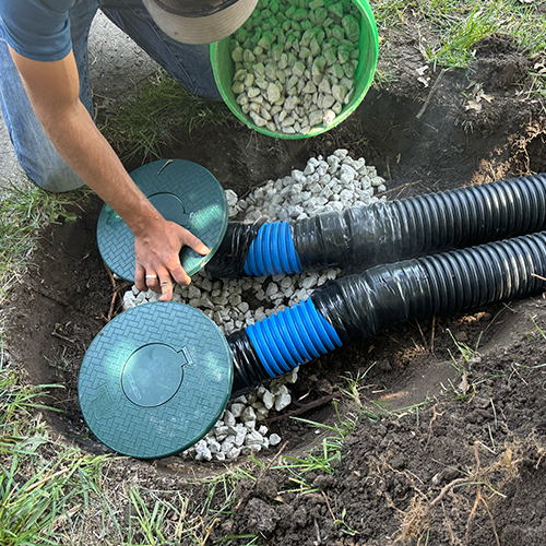 Gravel base in trench